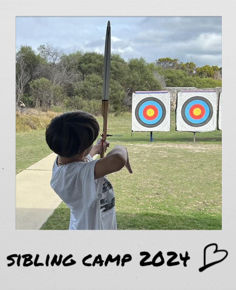 Polaroid image of a boy shooting a bow, titled “Sibling camp 2024”